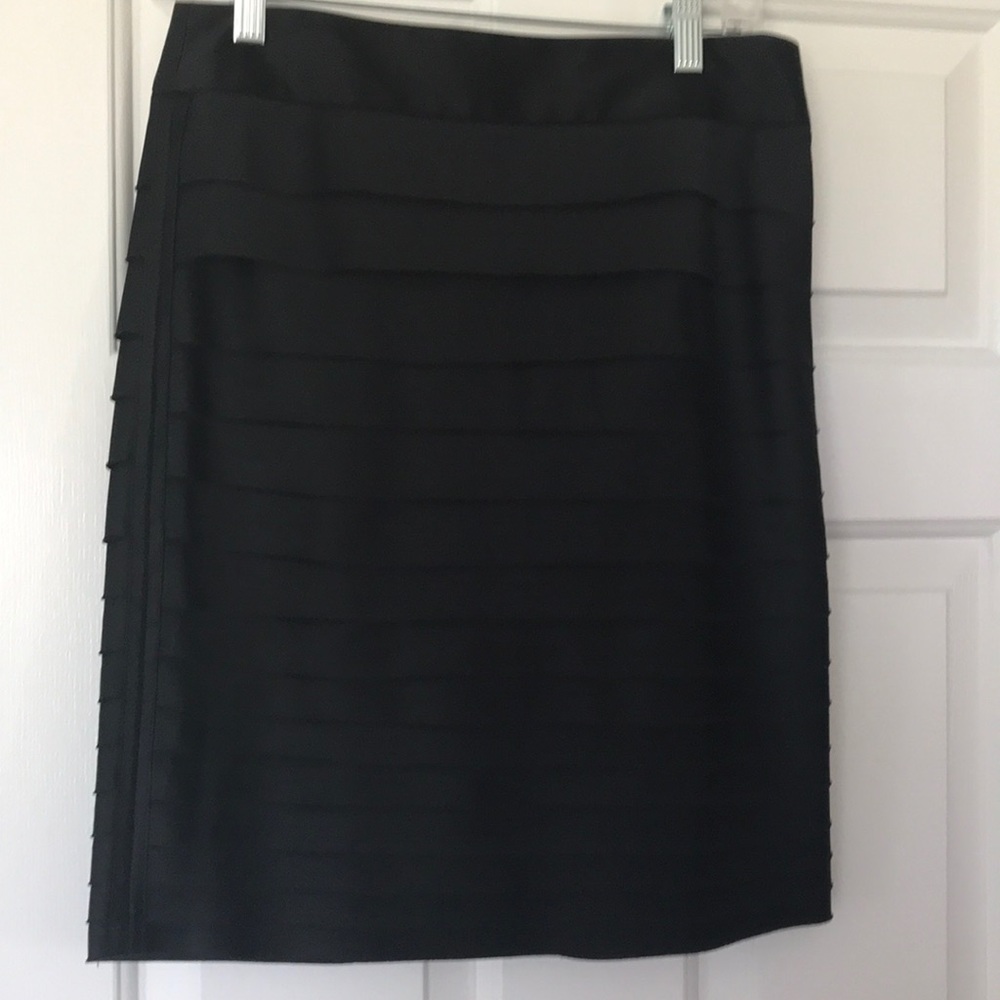 Black satin skirt.